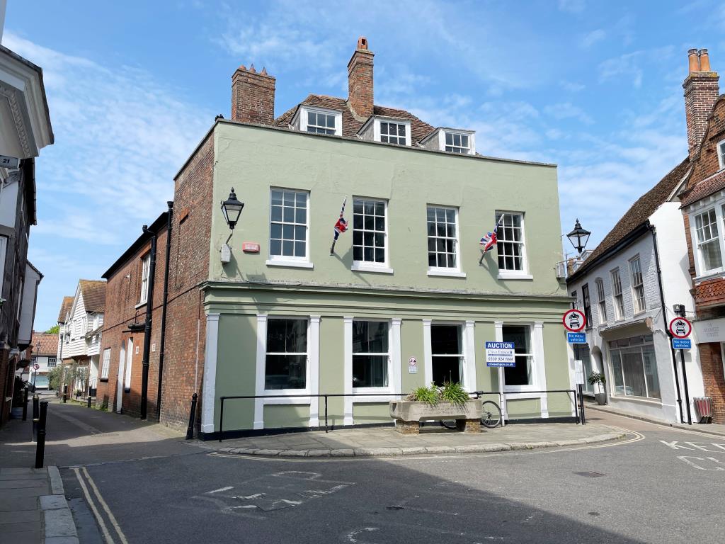 Lot: 100 - PERIOD BUILDING WITH PERMISSION FOR CONVERSION INTO TWO HOUSES - External photo of building in town centre